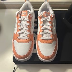 Nike pink shoes.